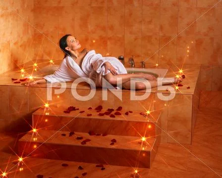 Woman relaxing in bath. Stock Photos