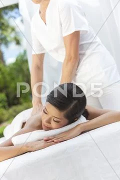 Woman relaxing at health spa having massage Stock Photos