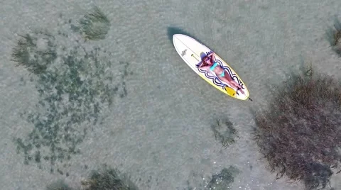 Woman relaxing paddleboarding on Samui Thailand standing Stock Footage 59109887