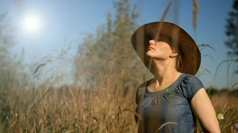 Woman relaxing in the sun Stock Footage