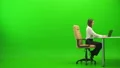 The woman relaxing at the table on the green background 4k or 4k+ Resolution