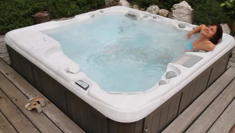 Woman relaxing in a Whirlpool / Jacuzzi Stock Footage