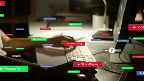 Woman responding to alerts, typing in tech space, badges clustering near Stock Footage 336714371
