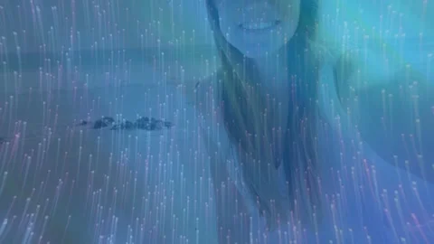Woman responding to camera pull, moving forward and tilting, smiling through Stock Footage 332504989