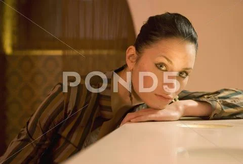 Woman resting on bar counter Stock Photos