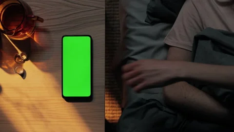 Woman resting in bed and using mobile with green screen Video stock 164036373