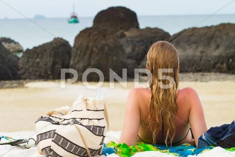 Woman at rhe beach Stock Photos