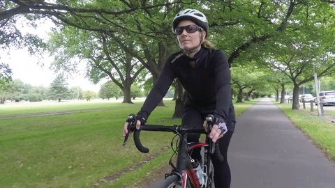 Woman Rides Bicycle Front View Close Up Stock Footage