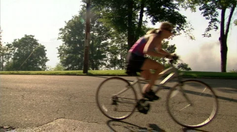 Woman Rides Bike 311 Stock Footage