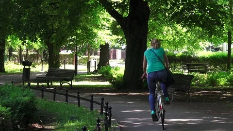 Woman riding on bike Stock Footage