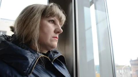 Woman riding in an elevator Stock Footage 56449170