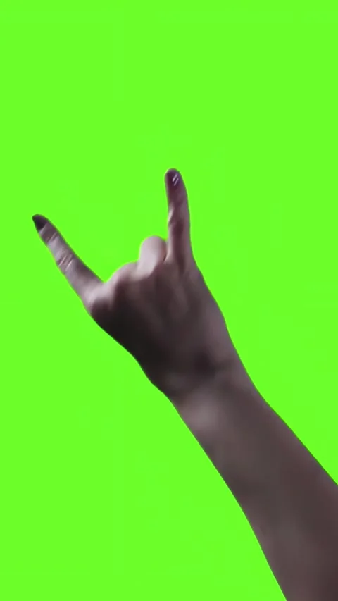 Woman with Rock and Roll Devil Horns Gesture Against Green Screen - 4K Vertical Stock Footage 285088105