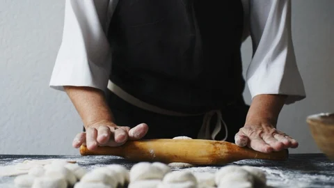 Woman rolling the dough by hands Stock-Footage 91982971