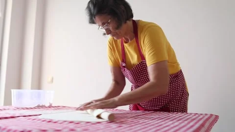 Woman rolling dough on table Stock Footage 280314232