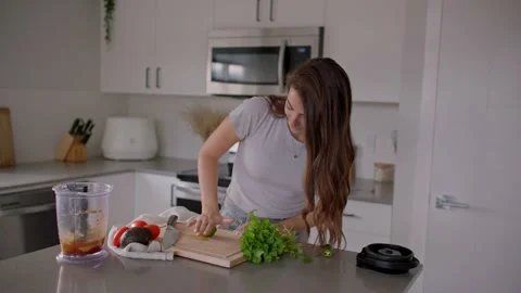 Woman rolling lime on kitchen table, cooking food Stock Footage 220753587