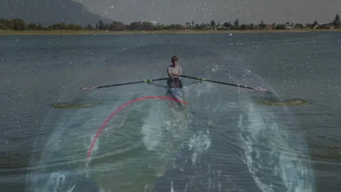 Woman rowing single scull with oars on calm lake, displaying fitness graphs Stock Footage 308100498