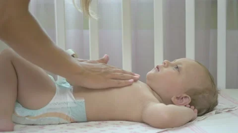 The woman rubs cream into belly baby. Stock Footage