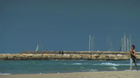 Woman runing on beach Stock Footage 25182355