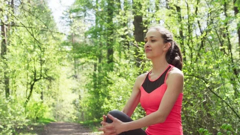 Woman runner doing warm-up exercise before jogging Stock Footage 107283497