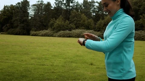 Woman runner using smart watch fitness watch Stock Footage 79351506