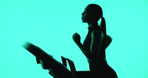 Woman, running and exercise in studio with treadmill, endurance training or Vidéo 330924852