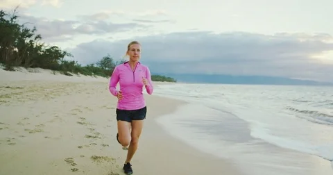 Woman Running on the Beach Stock Footage 81535673