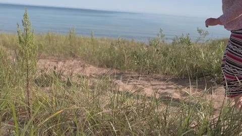 A woman running down the beach Stock Footage 145015967