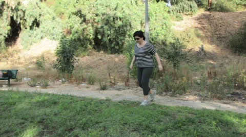 Woman running on the grass Video stock 24803655
