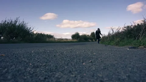 Woman running on lonely empty road Stock Footage 346042286
