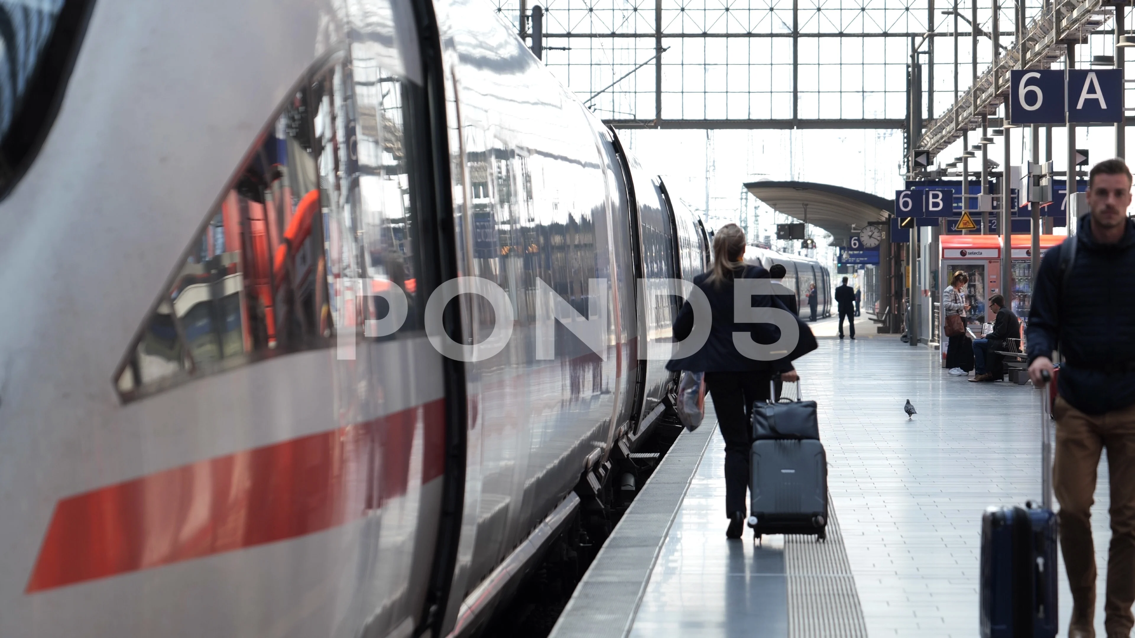 Woman running on platform to catch Train on Railway Station Frankfurt