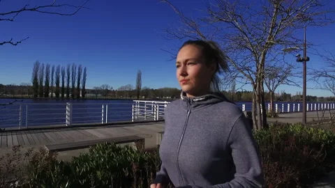 Woman Running by River Stock Footage 145252756