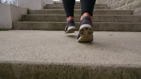 Woman Running On Steps Close Up Stock Footage