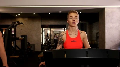 Woman Running on Treadmill Stock Footage 75355448