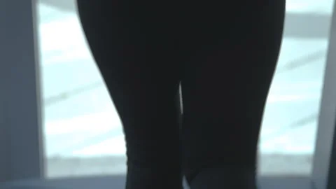 A woman running on a treadmill Stock Footage 235437671