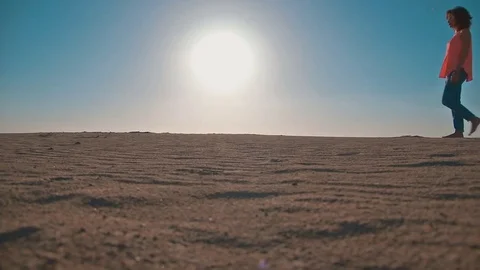 Woman on sandy beach Stock Footage 75743945