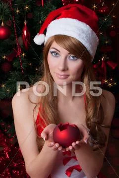 Woman santa helper with candle Stock Photos