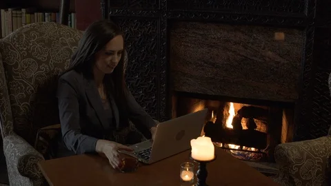 Woman sat at table using laptop. Stock Footage 88177658