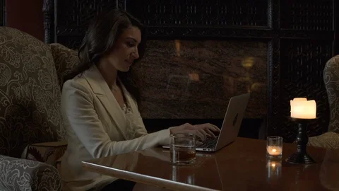 Woman sat at table using laptop. Stock-Footage 88177680