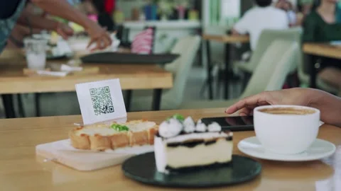 Woman scanning the QR code to order food and pay money. Restaurants protect v Stock Footage 164387810