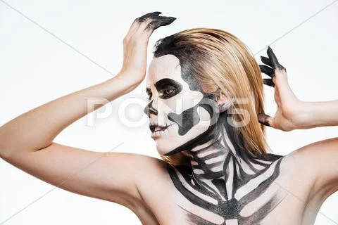 Woman with scared halloween makeup standing and posing Stock Photos