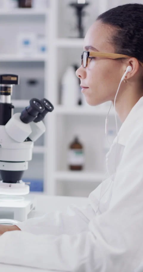 Woman, scientist and microscope with computer at lab for medical research, Stock Footage 329745163