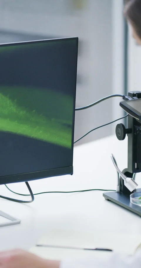 Woman, scientist and microscope with computer screen for plant, medical research Stock Footage 336737675
