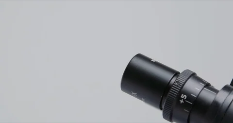 Woman scientist using microscope in a laboratory. Stock-Footage 125850019