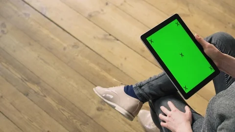 Woman scrolling through a tablet. Stock Footage 127061348