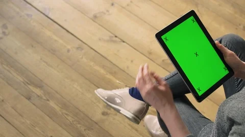 Woman scrolling through a tablet. Stock Footage 127062385
