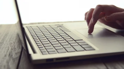 Woman Scrolls a Website Using Her Laptop Stock Footage 47894434