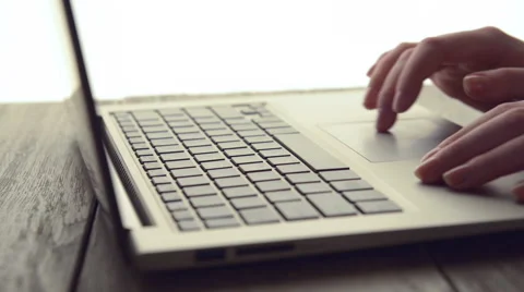 Woman Scrolls a Website Using Her Laptop Stock Footage 48287037