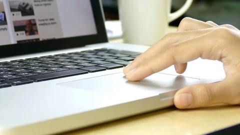 Woman Scrolls a Website Using Her Laptop Track Pad. Stock Footage 76009497