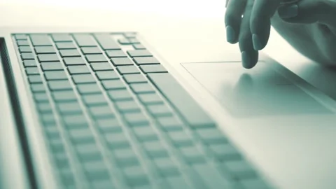 Woman Scrolls a Website Using Her Laptop Stock Footage 87836649