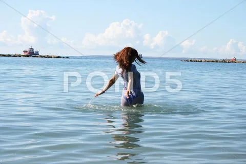 Woman in sea Stock Photos